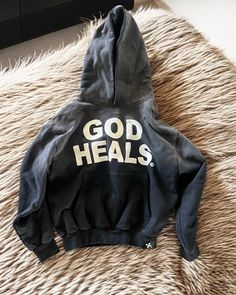 God Heals Hoodie | Inspirational Christian Hoodie | Comfortable Faith-Based Streetwear for Men and Women Stay stylish while expressing your faith with our "God Heals" hoodie. This hoodie offers a perfect blend of comfort, fashion, and a powerful spiritual message. Made from high-quality, soft, and durable fabric, this hoodie ensures warmth and coziness for everyday wear. Whether you're heading to church, spending time in prayer, or just relaxing with friends, the "God Heals" hoodie makes a bold Hoodies Ideas, 2000s Barbie, Barbie Closet, Grey Outfits, Spirit Art, God Heals, Printed Hoodies, Tops Men, Y2k Tops