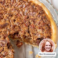 a pie with pecans on top and a woman's face next to it