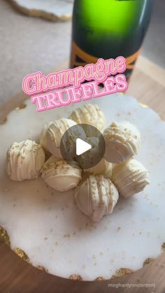 there is a video about champagne truffles on the table next to a bottle