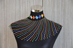 African Wedding Necklace, Beaded Bib Necklace For Women, Beaded Shawl Necklaces,  Multi Colour Bead Statement Necklace, Unique SisterGifts  Gorgeous South African Inspired necklace made using beads and thread. The necklace is a fashion item today among modern women who glam up outfits with the necklace or wear to occasions. LENGTH ; 14 inches DROP LENGTH: 8 inches. SHIPPING; All our orders ship via Dhl Express ( 3-5 business days ) for items to be delivered to you. To shop more necklaces; Zola AfricaCo homepage; zolaafricaco.etsy.com Black Beaded Necklaces For Wedding, South African Beads, Beaded Shawl, African Beads Necklace, Beaded Bib Necklace, Inspired Necklace, Bib Necklaces, Beaded Statement Necklace, Necklace Unique