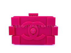 Chanel 2014 Pink Lego Brick Minaudière Plexiglass Clutch Shoulder Bag with woven chain in shiny ruthenium hardware.Woven chain can be tucked/hidden inside or carried as a crossbody.Dimensions are for the outside of the bag - will not carry an iPhone.In fuchsia pink plexigalss and shiny ruthenium hardware. Established 19 years ago, Boutique Patina has specialized in sourcing and curating the best condition vintage Chanel leather treasures by searching closets around the world.Measures 8in. W (at Chanel 2014, Woven Chain, Chanel Purse, Chanel Earrings, Lego Brick, Hermes Bags, Fuchsia Pink, Vintage Chanel, Chanel Handbags