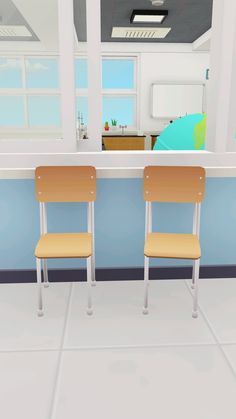 two wooden chairs sitting in front of a counter