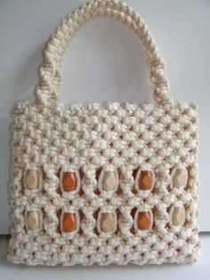 a crocheted bag hanging on a wall