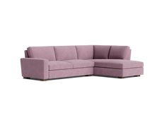 a purple sectional couch sitting on top of a white floor