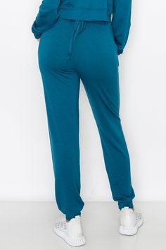 Made for active or relaxed days, these high rise relaxed joggers are the newest style added to our loungewear collection. Featuring a high-rise elasticized waistband with a drawstring detail, two pockets on each hip and cuffed hems, you’re going to love these full length loungewear joggers . High rise elasticized waistband Drawstring feature Two pockets on each hip Ultra-soft knit fabric with stretch 62% Polyester, 33% Rayon, 5% Spandex Imported Model StatsHEIGHT: 5'5" BUST: 32WAIST: 25.5HIPS: 3 Drawstring Jogger, Relaxing Day, Joggers Womens, Soft Knits, Design Details, Soft Fabrics, Knit Fabric, Knitted Fabric, Full Length