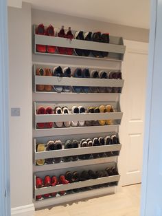 there are many pairs of shoes in the closet