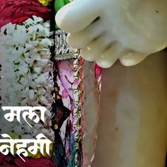 an image of the back of a woman's body with flowers and jewelry on it