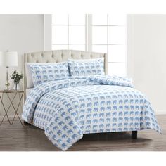 the elephant bedding set is made with blue and white elephants on it's sheets