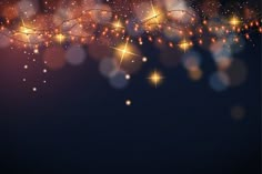 an abstract background with sparkling lights and stars