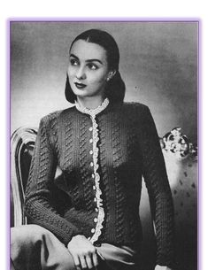 an old photo of a woman wearing a sweater