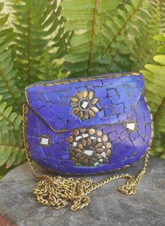 Vintage small evening clutch purse. Stylish, boho small purse for evening out. Brass and stone decorations. Handmade in India. Blue color with white stone and brass details. Fits card case, lipstick, money. Measurements approximately: Length 13cm High 10cm Depth 3cm String 110cm You may find more stone and brass handbags in my Etsy shop: EthnicShopCy For any extra details please send me a message and I will answer at my earliest. Color may look slightly different due to your device brightness or Handmade Bohemian Evening Bag, Bohemian Rectangular Evening Bag For Festivals, Blue Bohemian Clutch As A Gift, Blue Bohemian Clutch Gift, Blue Bohemian Clutch Handmade, Handmade Bohemian Blue Clutch, Handmade Blue Bohemian Clutch, Blue Bohemian Clutch For Festival, Bohemian Blue Clutch As Gift