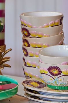 a stack of dishes sitting on top of a table