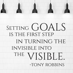 a white tiled wall with a quote on it that says, setting goals is the first step in turning the invisible into the visible