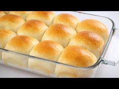 bread rolls in a glass baking dish ready to be baked