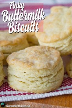 buttermilk biscuits on a red and white checkered cloth with the words, flaky buttermilk biscuits