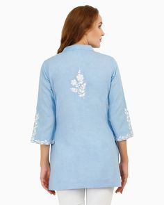 As you slip into the Celestial Tunic, you'll feel like you're being wrapped in a luxurious, celestial embrace. This blue cotton and linen tunic is not just a piece of clothing, it's a statement of style. The embroidery on the Celestial Tunic is exquisite, showcasing the intricate detailing that has been weaved into the design. The tunic top for women is made from premium quality cotton and linen, providing a comfortable and breathable fit for any occasion. Whether you're heading out for a casual Collarless Shirt, Linen Tunic, Thread Embroidery, Top For Women, Mandarin Collar, Tunic Top, Floral Embroidery, Piece Of Clothing, Linen Blend