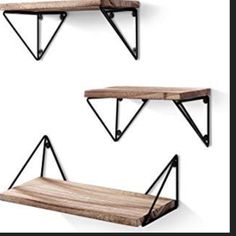 three wooden shelves with metal brackets on them