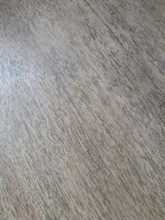 a close up view of the wood grains on this flooring material that looks like it has been scratched