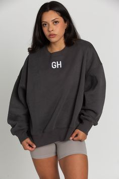 Brand NEW Off-Black GH Embroidered Sweatshirt is soon to be your favorite sweatshirt ever. It is a trendy, oversized fit that is perfect for snuggling up or layering. It features embroidered lettering and a cozy fleece inside lining. Cotton/Poly Blend, Fleece Lining Oversized Fit Embroidered Model Details: Modeled in size: Small Model Bust: 34 Model Waist: 30 Model Height: 5'6 Embroidered Lettering, Glam Doll, Boy Outerwear, Tennis Skirts, Embroidered Sweatshirt, Curvy Dress, Doll Shoes, Yoga Tops, Embroidered Sweatshirts