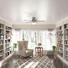 a living room filled with lots of furniture and bookshelves next to a window