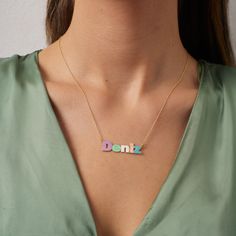 Personalized Colorful Name Silver Necklace Product Description: Add a vibrant and personalized touch to your jewelry collection with our Colorful Name Silver Necklace! This exquisite piece is more than just an accessory; it's a reflection of your unique style and individuality. Features: Personalized Elegance: Customize this stunning silver necklace with the name or word of your choice. Whether it's your name, a loved one's name, or a meaningful word, this necklace is a beautiful canvas for personalization. Dazzling Color Palette: The pendant features a rainbow of vibrant enamel colors, allowing you to express your personality and style. Choose from a wide range of hues to create a necklace that's uniquely yours. Quality Craftsmanship: Our artisans meticulously handcraft each necklace usin Mother's Day Personalized Enamel Necklaces, Personalized Multicolor Pendant Jewelry, Personalized Multicolor Name Necklace As Gift, Personalized Pink Enamel Necklace, Multicolor Name Necklace For Birthday, Personalized Multicolor Necklaces For Gifts, Customizable Multicolor Name Necklace As Gift, Personalized Multicolor Name Necklace For Birthday, Customized Multicolor Jewelry For Birthday Gift