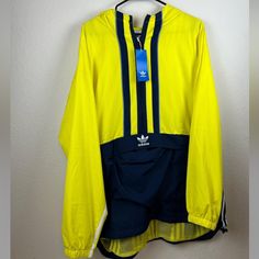 Please See Photos And Item Details For Size And Condition. Size Is Based On The Type Of Fit, The Manufacturer Size May Differ. Item Details - Nwt Brand New Adidas Anorak Jacket Mens Size Xl. Neon Yellow & Navy Colorway. Has Kangaroo Pouch. 3 Navy Stripes Down The Center. Has A Hood. All Items Are Guaranteed Authentic! All Items Are Free Of Stains, Rips, Or Tears Unless Otherwise Noted Or In Pictures. If You Have Any Questions Please Feel Free To Comment! Inv Bin2 Functional Yellow Windbreaker For Outdoor Activities, Yellow Functional Windbreaker For Outdoor Activities, Adidas Hooded Windbreaker With Pockets, Adidas Spring Windbreaker For Outdoor Activities, Adidas Windbreaker For Streetwear With Pockets, Adidas Yellow Outerwear For Streetwear, Functional Yellow Sports Outerwear, Yellow Track Jacket For Spring Streetwear, Yellow Functional Sports Outerwear