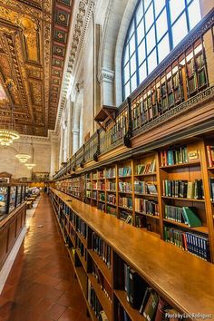 the inside of a library with many bookshelves