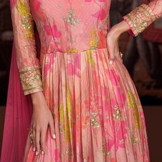 COLOR : Coral Pink FABRIC : Gown - Pure Georgette, Bottom - Mixed Fabric, Dupatta - Net WORK : Resham Embroidery, Zari Motifs, Floral Print, Sequins, Gota Patti, Lace BorderOCCASION : Wedding, Reception, Mehendi, Engagement, Party Wear, Festival READY-TO-WEAR : No STITCHING : Available as semi-stitched fabric, can be stitched using standard size option (+$20). Note: There might be a slight color variation due to lighting and flash used during photoshoot. The bright shade seen is the best closer Pink Anarkali Gown, Pink Anarkali, Resham Embroidery, Anarkali Gown, Peach Dress, Coral Peach, Net Dupatta, Color Coral, Lace Border