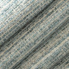 a close up view of the texture of fabric in grey and blue tones, with small stripes