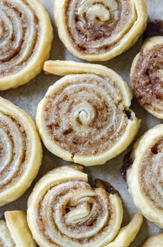 cinnamon rolls are arranged on a baking sheet