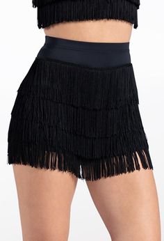 a woman is wearing a black skirt with fringes