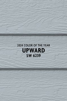 the color of the year upward sw 619 is white and has black lettering on it