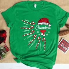 Grandma Christmas Candy Kid Names T-ShirtIf you looking for a personalized t-shirt to show your love to your family, it's will be best choice. Our Classic T-Shirt serves as the perfect short-sleeved shirt for your unique, funny, or personalized designs. Features such as a lay flat collar and a classic?ÿunisex cut will make this your new favorite t-shirt. Brand: Gildan Heavy weight fabric Classic unisex?ÿmakes this an easy fit Size up if you want something roomier Our shirts include:- Sport Grey Christmas Photo Booth Backdrop, Cowboy Birthday Party, Grandma Christmas, Custom Made Dress, Christmas Photo Booth, Make Your Own Shirt, Grandmas Christmas, Gender Reveal Balloons, Dog Shirts