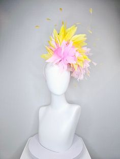 From the 2024 Featured Milliner of the Kentucky Derby Museum    Gorgeous Kentucky Derby hat fascinator  kentucky derby hat fascinator blush pink sinamay with pink feather flower and feathers with yellow feathers  headband attachment.  each hat is totally one of a kind! no two are alike! I can probably add feathers, flowers etc to existing hats for a small fee. I cannot remove anything from existing hats. Just message me and see if we can make it work! :) I cannot make custom order from scratch. Yellow Rose Flower, Derby Hats Fascinators, Yellow Feathers, Hat Fascinator, Large Feathers, Purple Feather, Feather Flower, Feather Headband, Kentucky Derby Hat