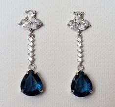 Navy Blue Teardrop Crystal Silver CZ Dangle Wedding Bridal Earrings. PLEASE READ ITEM DESCRIPTION and SHOP POLICIES before placing your order, and contact me with any questions! EARRINGS are about 1.53 inch (3.9cm) long from top of earring stud to bottom. BRIDAL EARRINGS SECTION: https://www.etsy.com/shop/LanaChayka?ref=seller-platform-mcnav&section_id=11638940 EARRINGS SECTION: https://www.etsy.com/shop/LanaChayka?ref=simple-shop-header-name&listing_id=95683858§ion_id=17999866&sort_order=date_desc NECKLACES SECTION: https://www.etsy.com/shop/LanaChayka?ref=seller-platform-mcnav§ion_id=17026331 Elegant and classy, these stunning earrings are perfect for weddings or special occasions such as birthdays, anniversaries, graduations, proms...or whatever you can imagine! Handmade earrings, are m Blue Dangle Crystal Earrings For Formal Occasions, Blue Drop Bridal Earrings For Formal Events, Blue Drop Bridal Earrings For Formal Occasions, Blue Teardrop Earrings For Formal Occasions, Blue Teardrop Chandelier Earrings For Formal Occasions, Formal Blue Teardrop Chandelier Earrings, Blue Teardrop Chandelier Earrings For Anniversary, Blue Drop Earrings For Bridal Formal Occasion, Blue Drop Earrings For Formal Bridal Wear