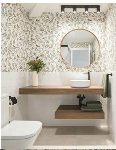 a bathroom with a sink, mirror and toilet