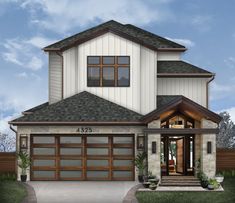 the front view of a two story house with garage doors and windows on both sides