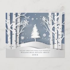 a paper cut christmas card with trees and snow