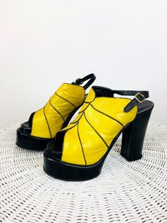 "Vintage 1970s Yellow & Black Platforms - super rare! - 30s style - yellow & black leather - open peep toe - ankle straps - sky high heel - double platform, also at inner sole - by esprit, not the 80s esprit Great vintage condition, minimal wear size 7 5 \"T heel 2.25\"T at front 3.25\"W All sales are final / as-is. We do not accept returns." Bold Yellow Open Toe Heels, Retro Black Sandals For Party, Vintage Yellow Heels For Summer, Retro Black Party Sandals, Yellow Vintage Heels For Summer, Yellow Fitted Sandals For Evening, Vintage Yellow Summer Heels, Fitted Yellow Sandals For Evening, Vintage Yellow Heels With Round Toe