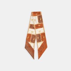 Calling all bag lovers this lightweight silk skinny scarf features a playful motif of our customer-favorite Tabby bags. Finished with a solid border wear it around your neck to add distinctive style to any look. | Coach Tabby Bag Print Silk Wide Skinny Scarf - Women's - Burnished Amber Chic Rectangular Silk Scarf For Gifts, Chic Rectangular Silk Scarf As A Gift, Luxury Rectangular Scarves, Luxury Multicolor Rectangular Silk Scarf, Luxury Silk Scarf For Formal Occasions, Luxury Rectangular Silk Scarf For Formal Occasions, Trendy Rectangular Silk Scarf, Chic Multicolor Rectangular Scarves, Trendy Brown Scarves For Gifts