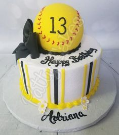 a decorated birthday cake with a baseball on top