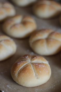 freshly baked bread rolls on a baking sheet