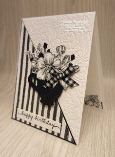 a handmade card with flowers on it and the words happy birthday written in black ink