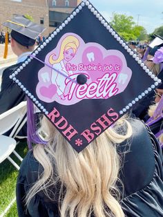 a woman wearing a graduation cap that reads, this barbie's job is teen