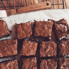 brownies cut into squares sitting on top of a table