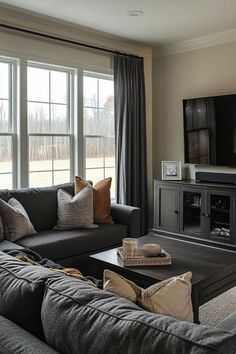 a living room filled with furniture and a flat screen tv