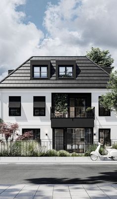 a white scooter parked in front of a two story house with black windows