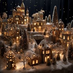 a christmas village with lit up trees and houses in the snow, surrounded by lights