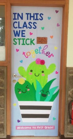 a door decorated with two cactuses and the words in this class we stick together