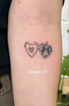 a couple of hearts tattoo on the arm